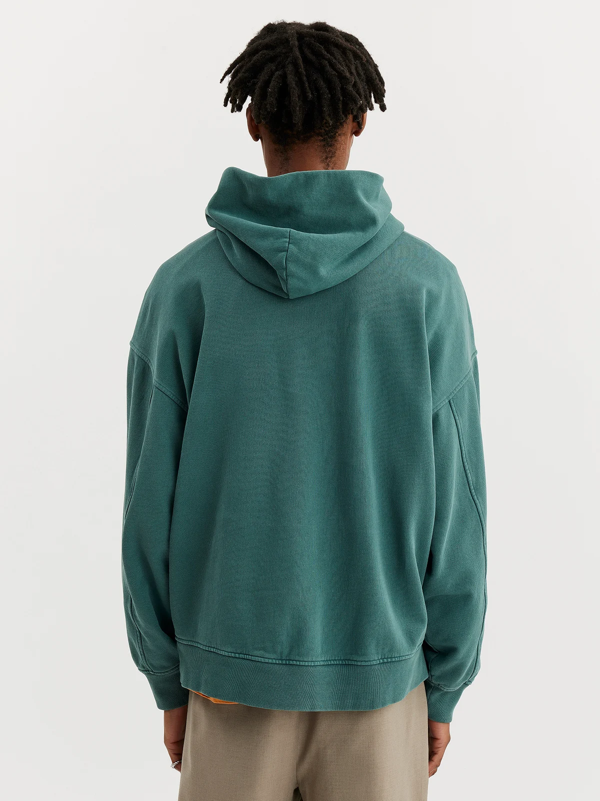 guy wering sand hoodie