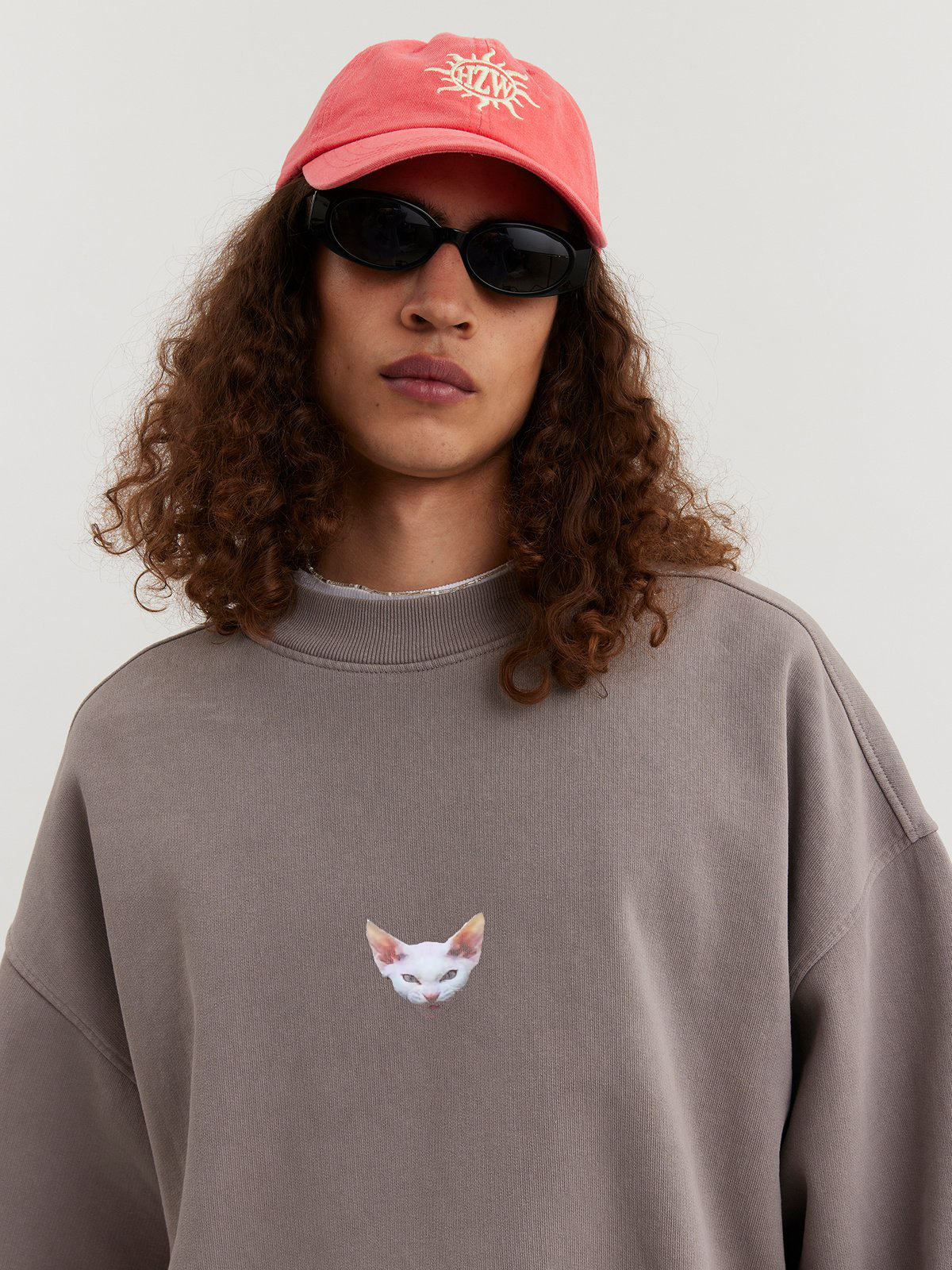 Man wearing gray sand Crewneck