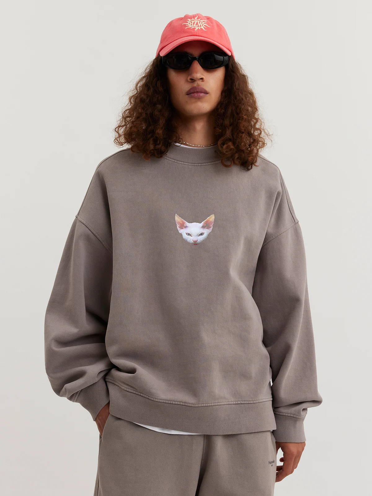 Man wearing gray sand Crewneck