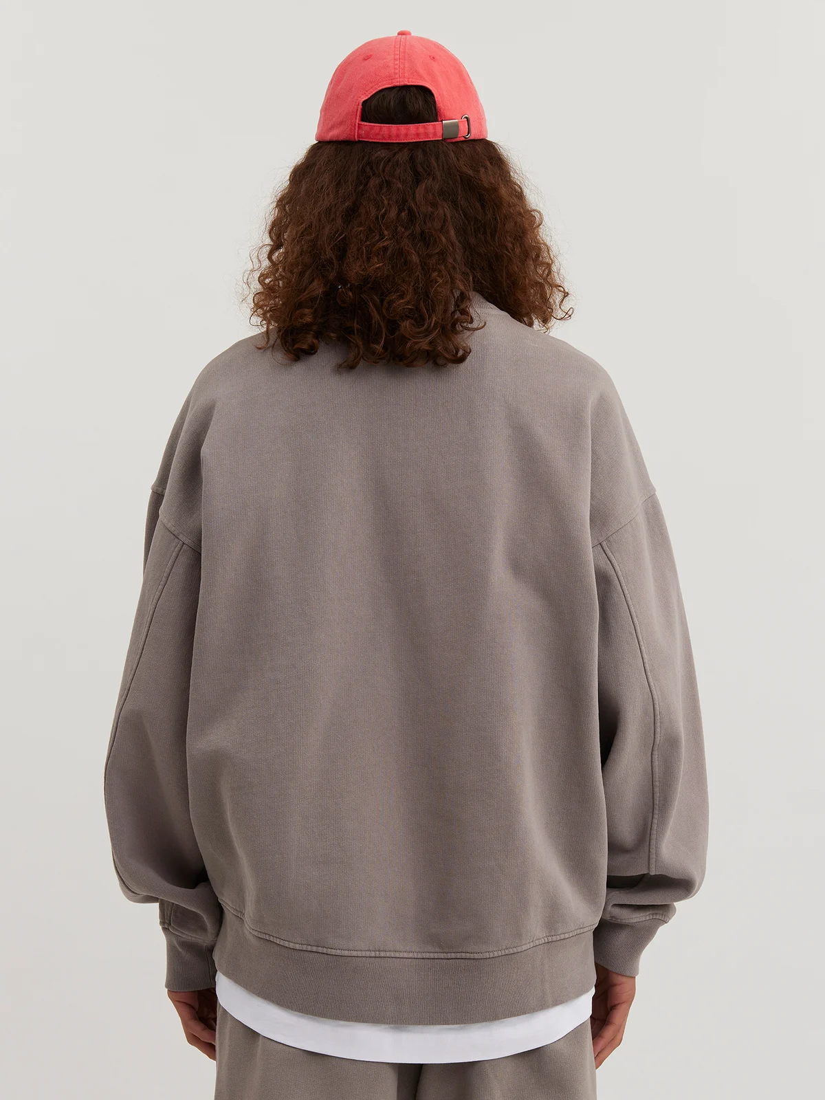 Man wearing gray sand Crewneck