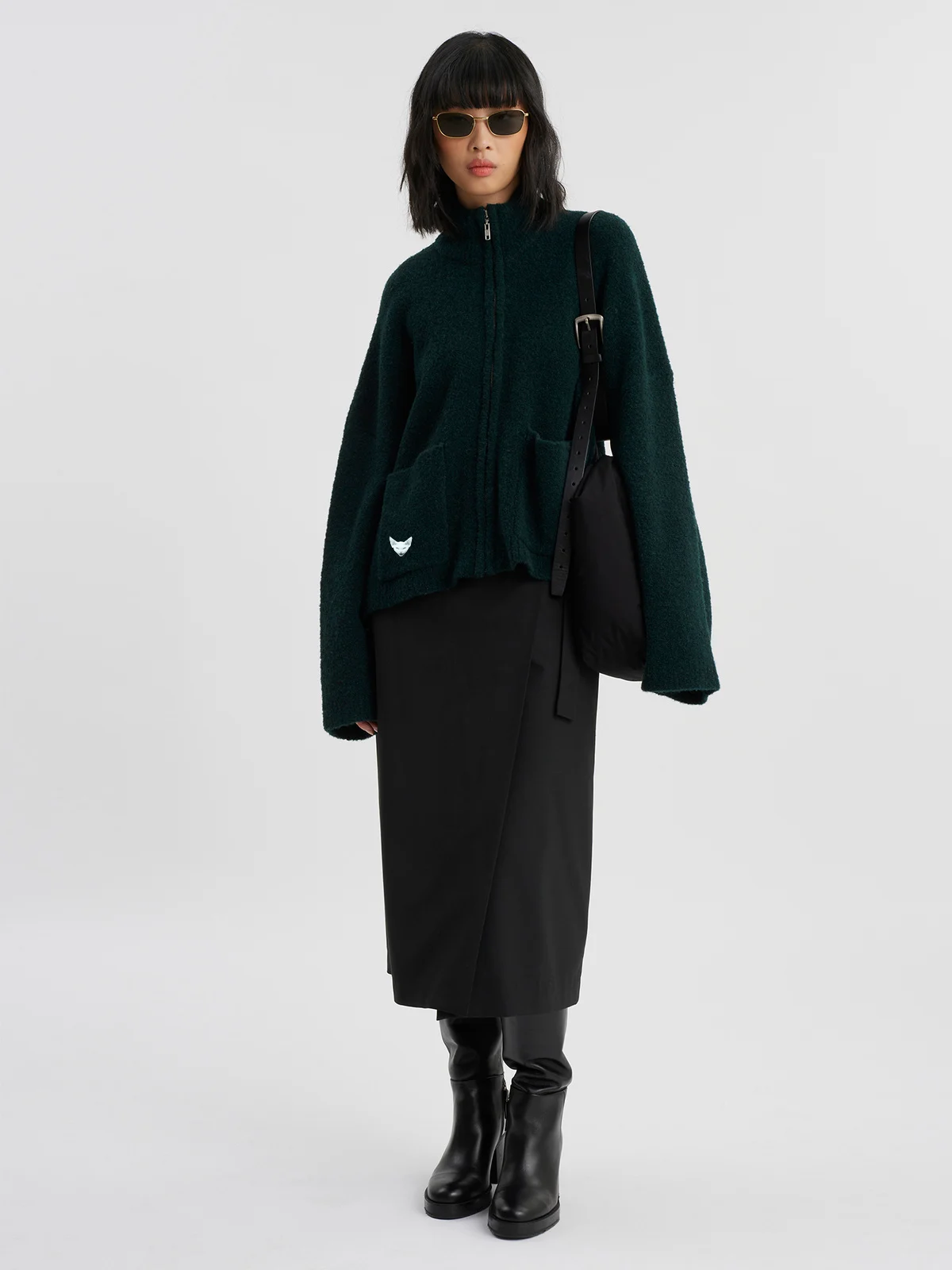 woman wearing darkgreen zip cardigan