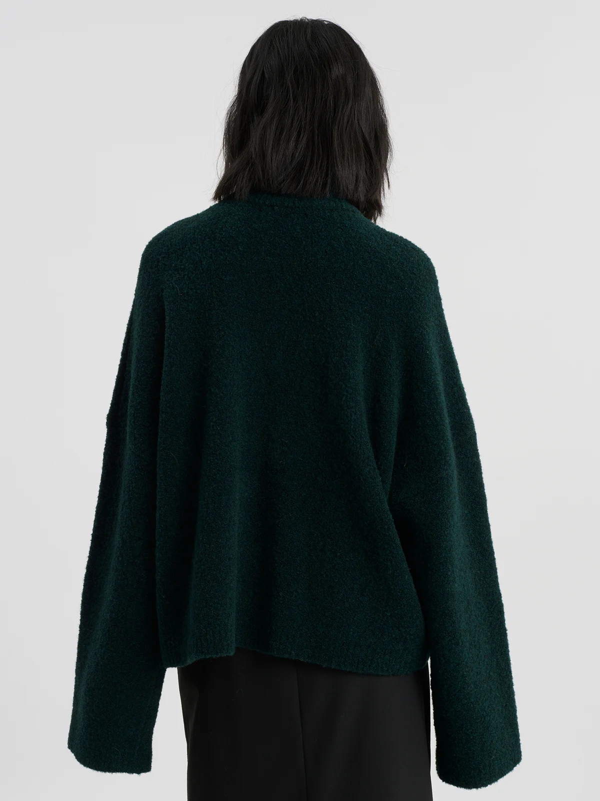 woman wearing darkgreen zip cardigan