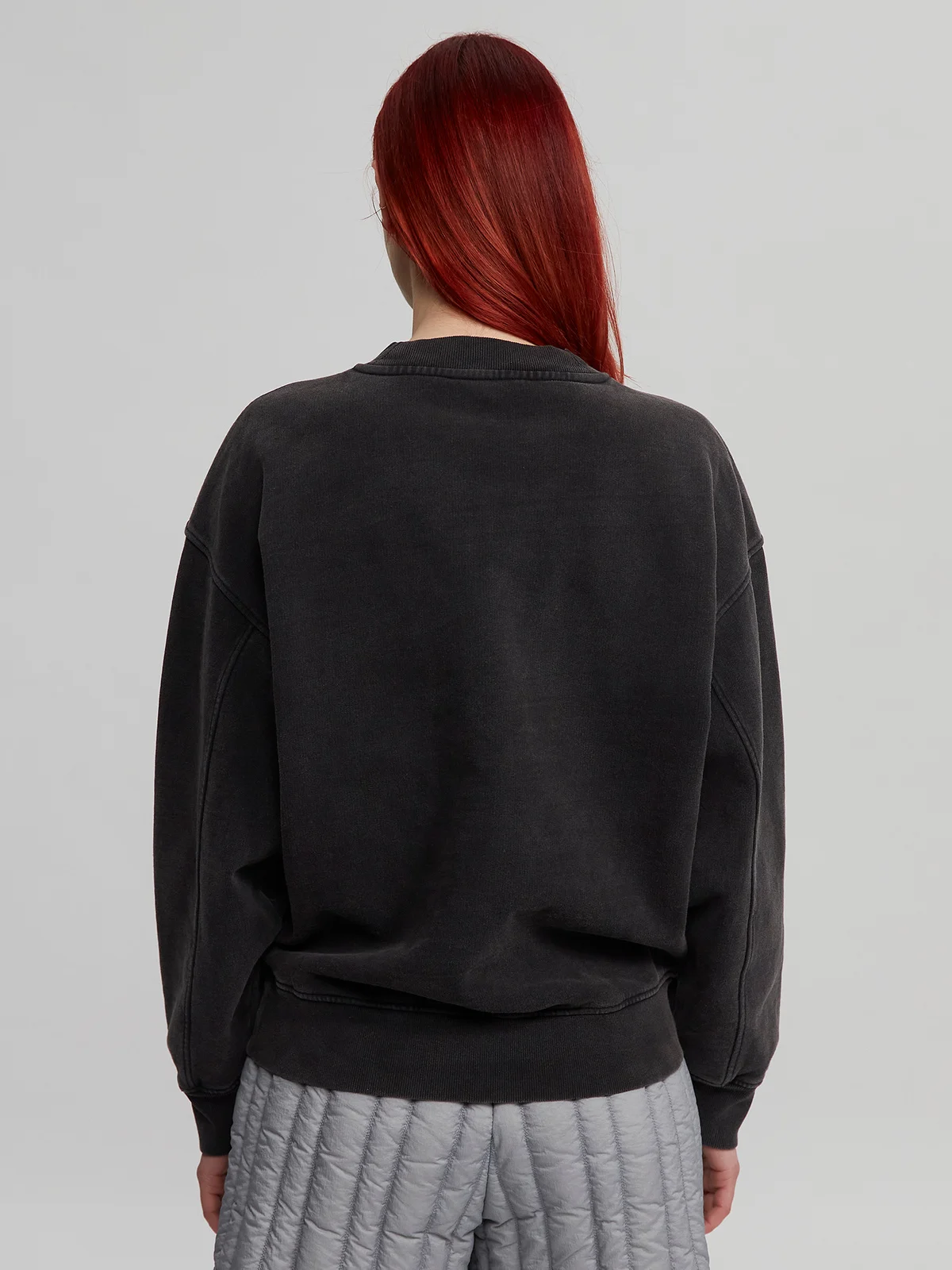 Woman wearing black Crewneck
