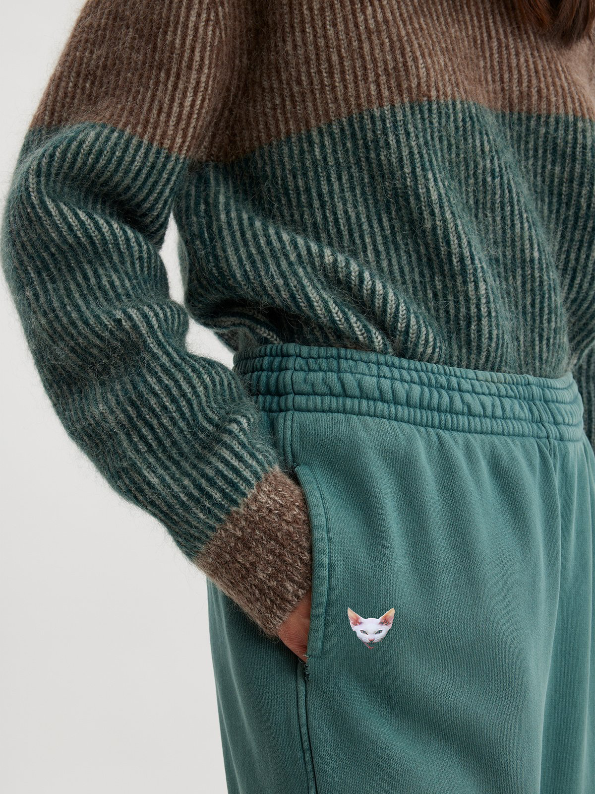 Woman wearing forest green joggers
