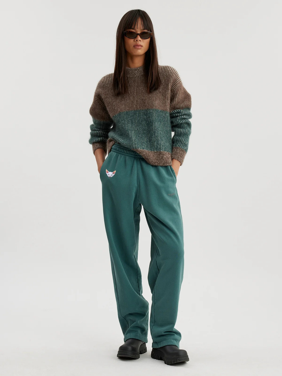 Woman wearing forest green joggers