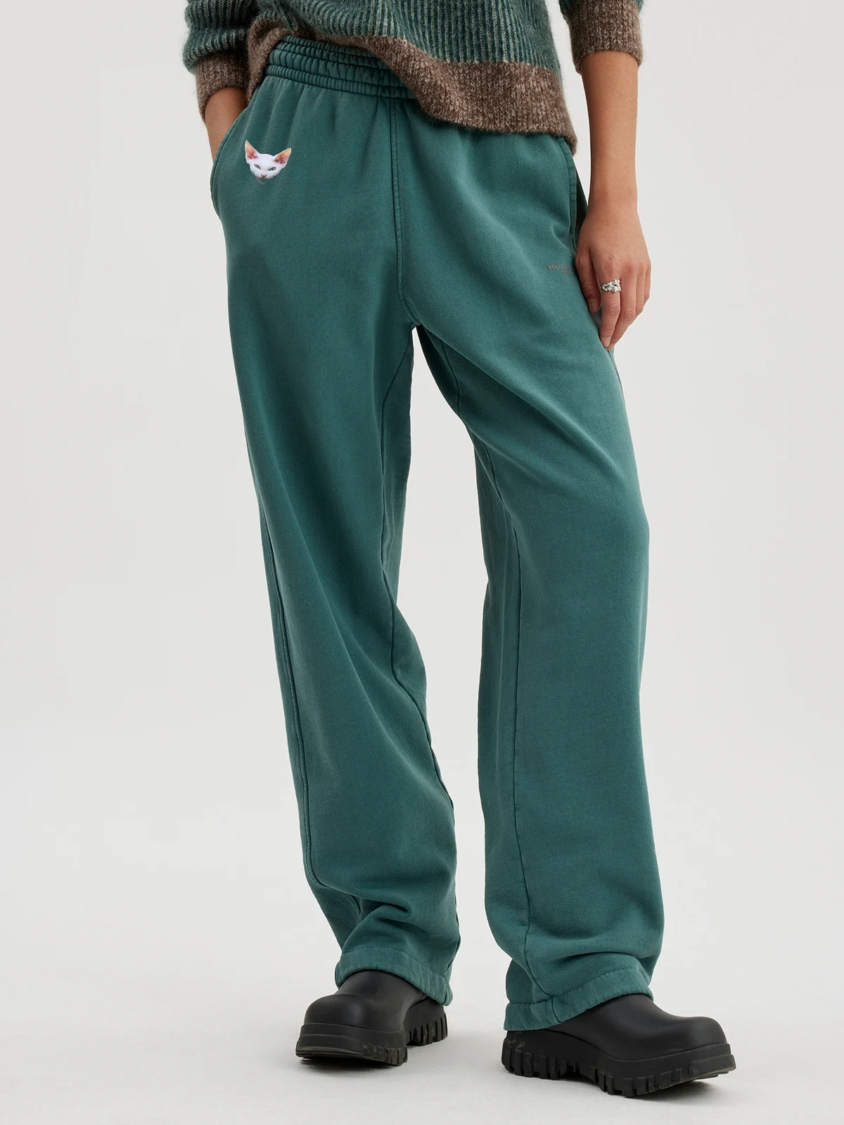 Woman wearing forest green joggers